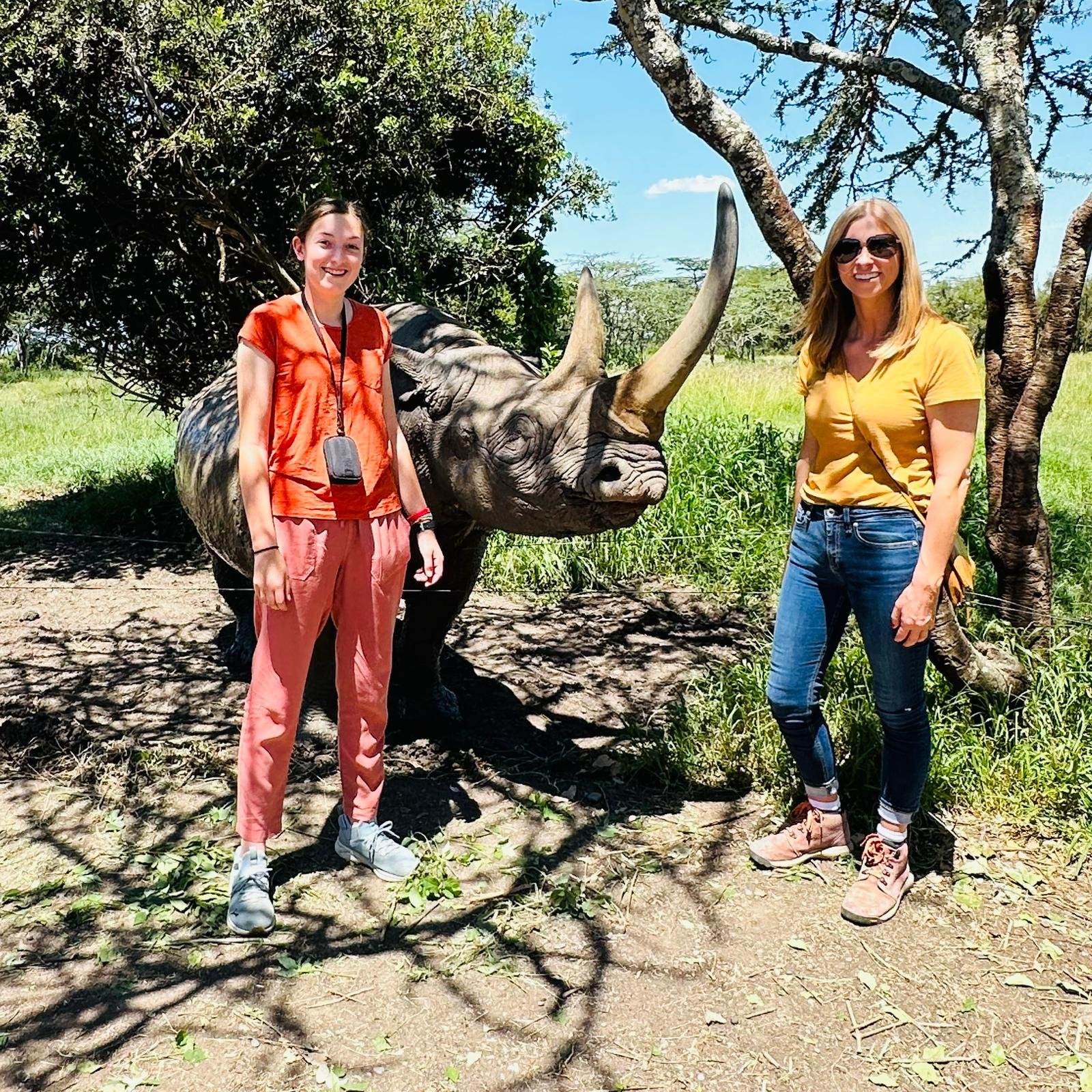 Picture of two tourist with black rhino
